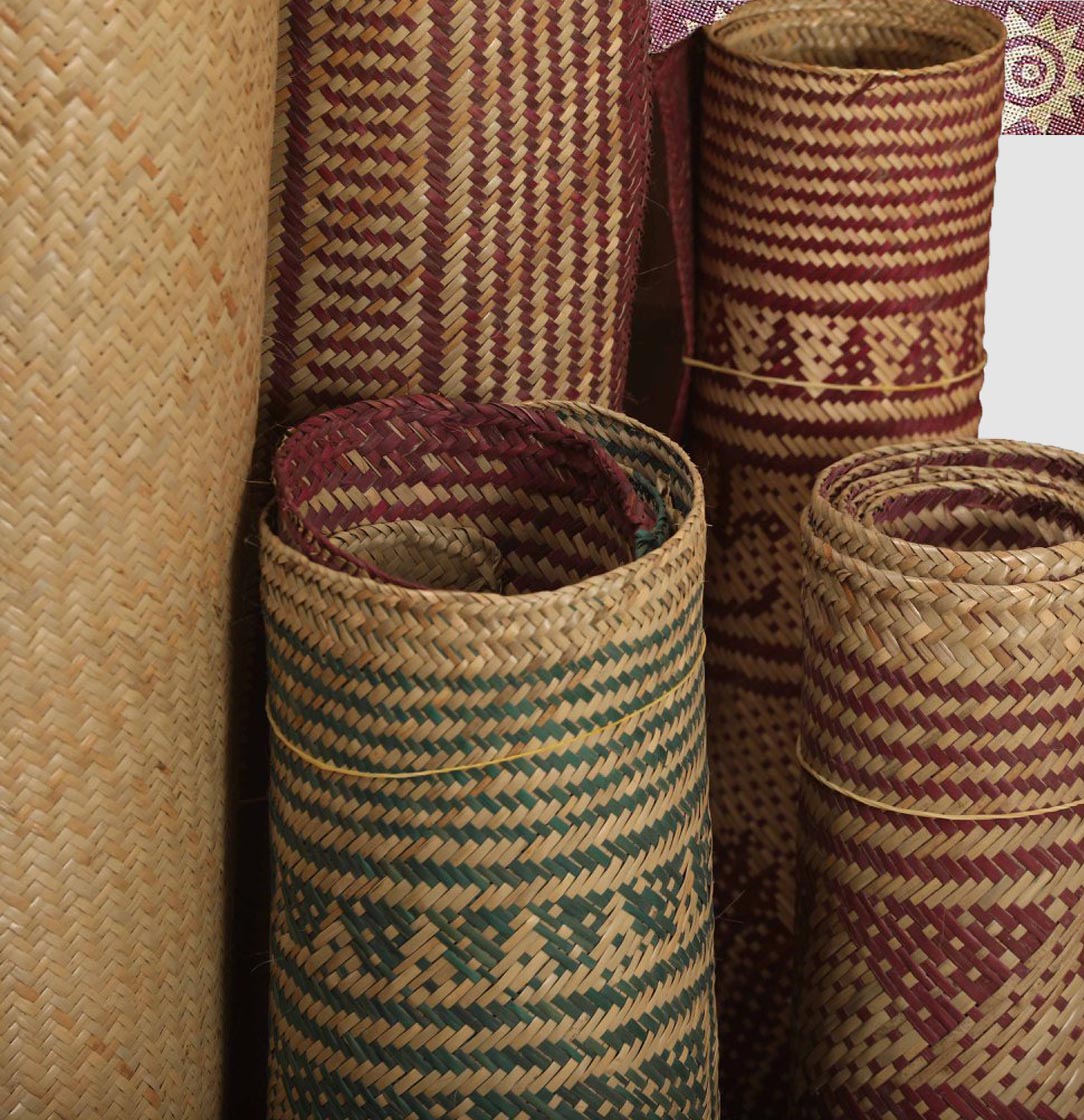 Rolls of handwoven shital pati mats in natural cane